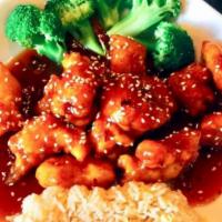 Sesame Chicken · Battered white meat chicken chunk, deep fried and sauteed with broccoli in sweet brown sauce...