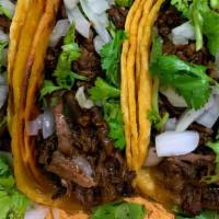 Barbacoa Tacos · 3 tacos,regular corn size tortillas,barbacoa
served with onion,cilantro and cabbage.