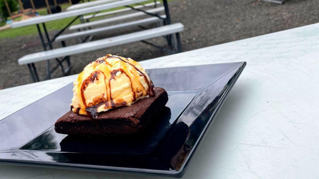 Brownie A La Mode · Texas size brownie topped with vanilla ice cream and drizzled with caramel and chocolate sauce.