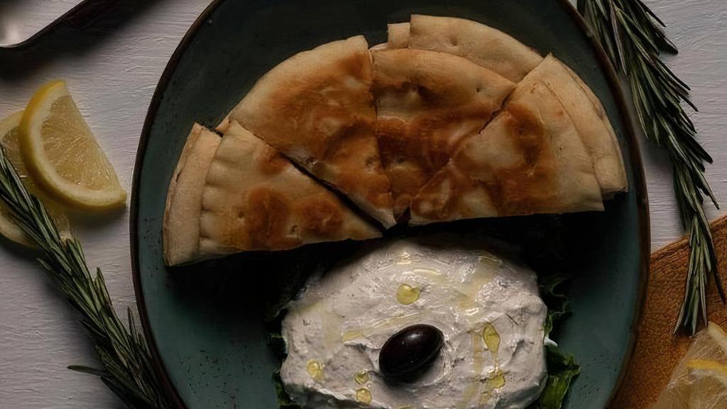 Tzatziki · served with hot fresh pita bread sub carrots or cucumbers for pita