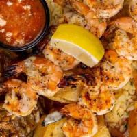 Shrimp Souvlaki Platter · two skewers of shrimp | basted with lemon-butter garlic puree | served with signature feta-t...