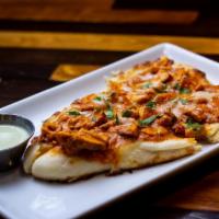 Butter Chicken Flatbread · A great way to try our Indian kitchen as a snack! Our famous butter chicken on a flatbread b...