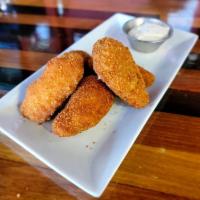 Jalapeno Poppers · breaded jalapenos stuffed with cheese