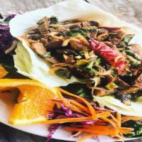 Nam Tok (Beef Salad) · Grilled tri-tip beef, lemon grass, scallions, shallots, sawtooth coriander, roasted thai chi...