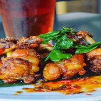 Muay Thai Chicken Wings · Five antibiotic-free chicken wings marinated in a spicy thai sauce, thai chili peppers, and ...