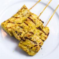 Satay · Three skewers of thinly sliced chicken or beef, marinated in thai spices. Served with curry ...
