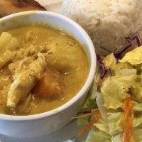 Yellow Curry · Sweet yellow coconut cream curry with white onion, carrot and potatoes with your choice of c...