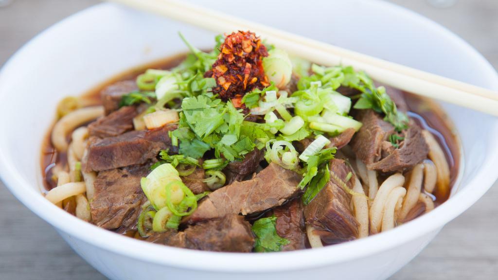 Spicy Beef Noodle Soup · Our fresh, springy noodles are glowing with melt-in-you-mouth beef tenderloin, deeply spiced beef broth, fresh herbs and our house-made toasted chili oil.