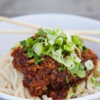 Spicy Garlic Peanut Noodles · Vegan. Wok-toasted peanuts and garlic, our house chili oil and hints of sesame and soy! Serv...