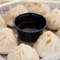 Soup Dumplings (8 Count) · Xiao long bao! Hand rolled thin and chewy wrappers contain hot and savory chicken and seafoo...