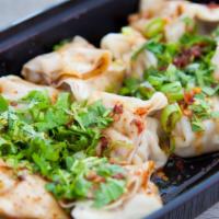Wontons In Chili Sauce · A big favorite here: rich flavorful pork in a thin and delicate wrapper, steamed and served ...