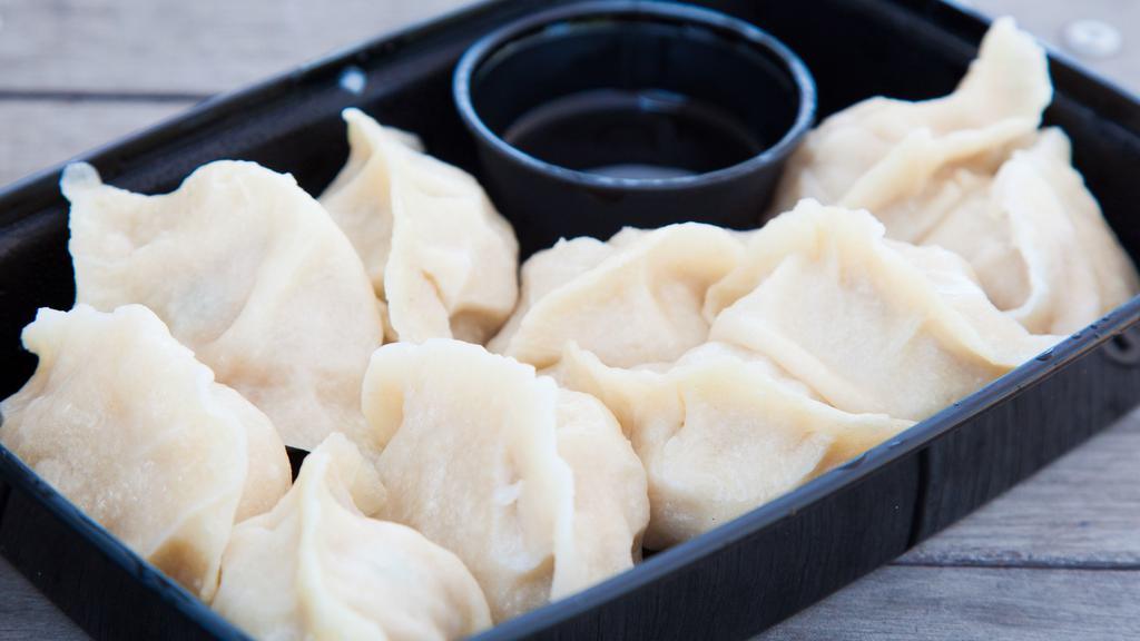 Pork Dumplings · An authentic, simple but delicious classic! Housemade hand rolled wrappers with pork, napa cabbage and a savory garlic chive filling. Served with Taiwanese soy sauce. 10 count.