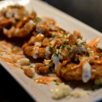 Fried Green Tomatoes · A traditional southern classic of deep-fried green tomatoes drizzled with buttermilk ranch, ...