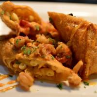 Voodoo Eggrolls · Dried-fried egrolls filled with Cajun mac & cheese, sausage, crawfish and shrimp.