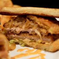 Lola K. Chop Sandwich · Deep fried pork chop on buttery Texas toast topped with lettuce, tomatoes, grilled onions an...