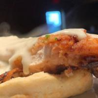 Chicken Fried Chicken · Buttermilk biscuit topped with pan-fried chicken breast & white pepper gravy served with mas...