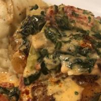 Creamy Spinach Chicken · Roasted Chicken thighs topped with a cream spinach & tomato sauce served with roasted red po...