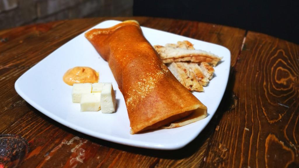 The Chicken Crepe · Includes chicken fajita, cheese, chipotle syrup, vegetables.