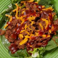 Cheeseburger Salad · Grass-fed beef burger, reduced fat cheddar, tomatoes, scallions with a blend of fat-free BBQ...