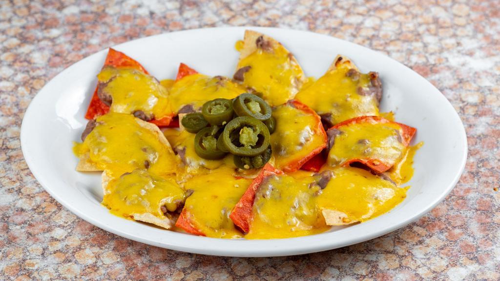 Full Order Bean & Cheese Nachos · Bean and cheese nachos served with jalapeños. 12 nachos come in a full order.