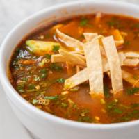 Tortilla Soup · Chicken and tomato broth garnished with sliced avocado, shredded chicken, Chihuahua cheese, ...