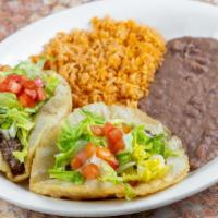 Puffy Taco Plate · Two puffy tacos stuffed with your choice of: beef, chicken, beans, or guacamole. Served with...