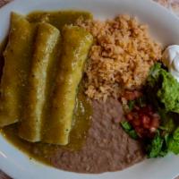 Enchiladas Verdes · Three soft corn tortillas stuffed with shredded chicken and topped with our verde sauce and ...