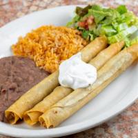 Crispy Flautas · Three corn tortillas rolled and filled with shredded chicken and fried to a golden crisp. To...