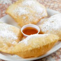 Homemade Sopapillas · Served with powdered sugar, cinnamon, and honey. Four to an order.