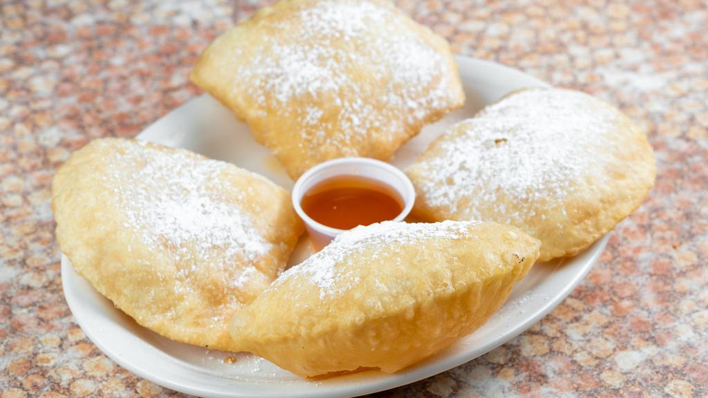 Homemade Sopapillas · Served with powdered sugar, cinnamon, and honey. Four to an order.