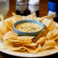 Chips & Queso · Our house blend of melted cheese topped with Pico De Gallo. Load 'em up! Add sour cream, gro...