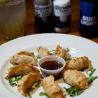 Pot Stickers · Eight Pork Dumplings Lightly Pan-Fried. Served with Soy Chili Sauce.
