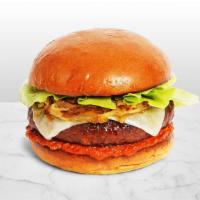 The New Classic Burger · Beef patty with lettuce, ketchup, caramelized onions, mayo, and melted swiss cheese on a flu...