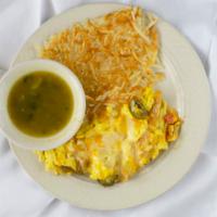 Migas · With scrambled eggs, onions, jalapenos, tomatoes, crispy tortilla strips and cheese with has...