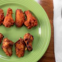 Wings · Tasty spicy hot chicken wings. Also available in BBQ flavor. Served with ranch dressing.