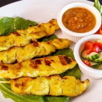 Satay (4) · Marinated grilled chicken skewers served with peanut sauce and cucumber salad.