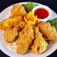Fried Chicken Wings (6) · Marinated chicken wing deep fried to golden crisp. Served with thai sweet chili sauce.