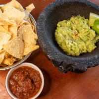 Guacamole & Chips · Fresh made 1/2 pint  of mild  guacamole, and 1 bags of  chips ( salsa not included) ( Tables...