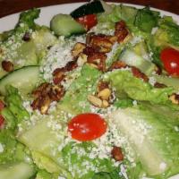 Mango House Champagne Salad · Romaine, caramelized pecans and pumpkin seeds, fresh cheese.   House made Champagne Vinaigre...