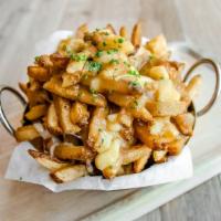 Poutine · Fresh cut fries, hot beef gravy, cheese curds, chives
