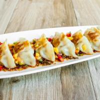 Potstickers · Pork dumplings with chili ponzu and fresh pineapple salsa