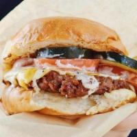 Hamburguesa · Served on a local vegan grilled bun.  vegan homemade tangy burger sauce. organic homemade pi...