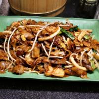 Fried Koay Teow · Flat noodles and egg noodles stir-fried over very high heat with light and dark soy sauce, s...