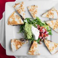 Two Quesadillas · (2) Flour tortillas with cheese. Your choice of chicken, steak, or shrimp. Served with guaca...