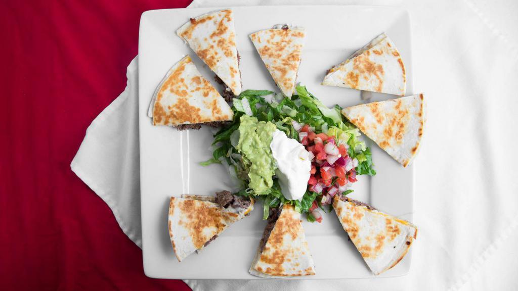 Two Quesadillas · (2) Flour tortillas with cheese. Your choice of chicken, steak, or shrimp. Served with guacamole.
