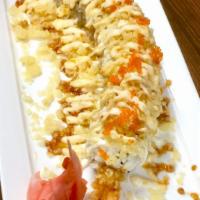 Crazy Crunch Roll · In side: shrimp tempura, sesame seed
on top: tempura flakes, mayo, eel sauce, masago.