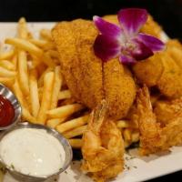 Fried Combo · Two pieces of fish, six pieces of shrimp and three pieces of oyster. with a side of french f...