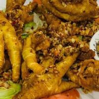 Spicy Fried Chicken Feet · crispy chicken feet fried to perfection with a salted dry chili seasoning.