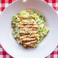 Chicken Caesar Salad · Chicken Caesar salad is served with Caesar dressing, croutons, grilled chicken, Parmesan che...