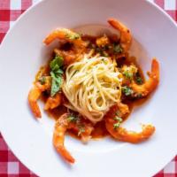 Shrimp Al Diablo · Shrimp sautéed over garlic and basil wine sauce over linguine pasta.